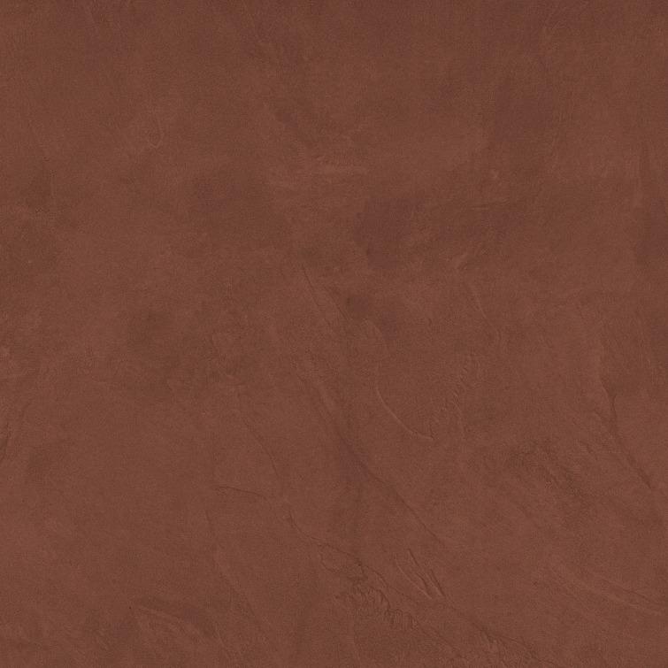 A textured surface in a rich, warm shade of brown, resembling plaster or clay with subtle variations in tone.