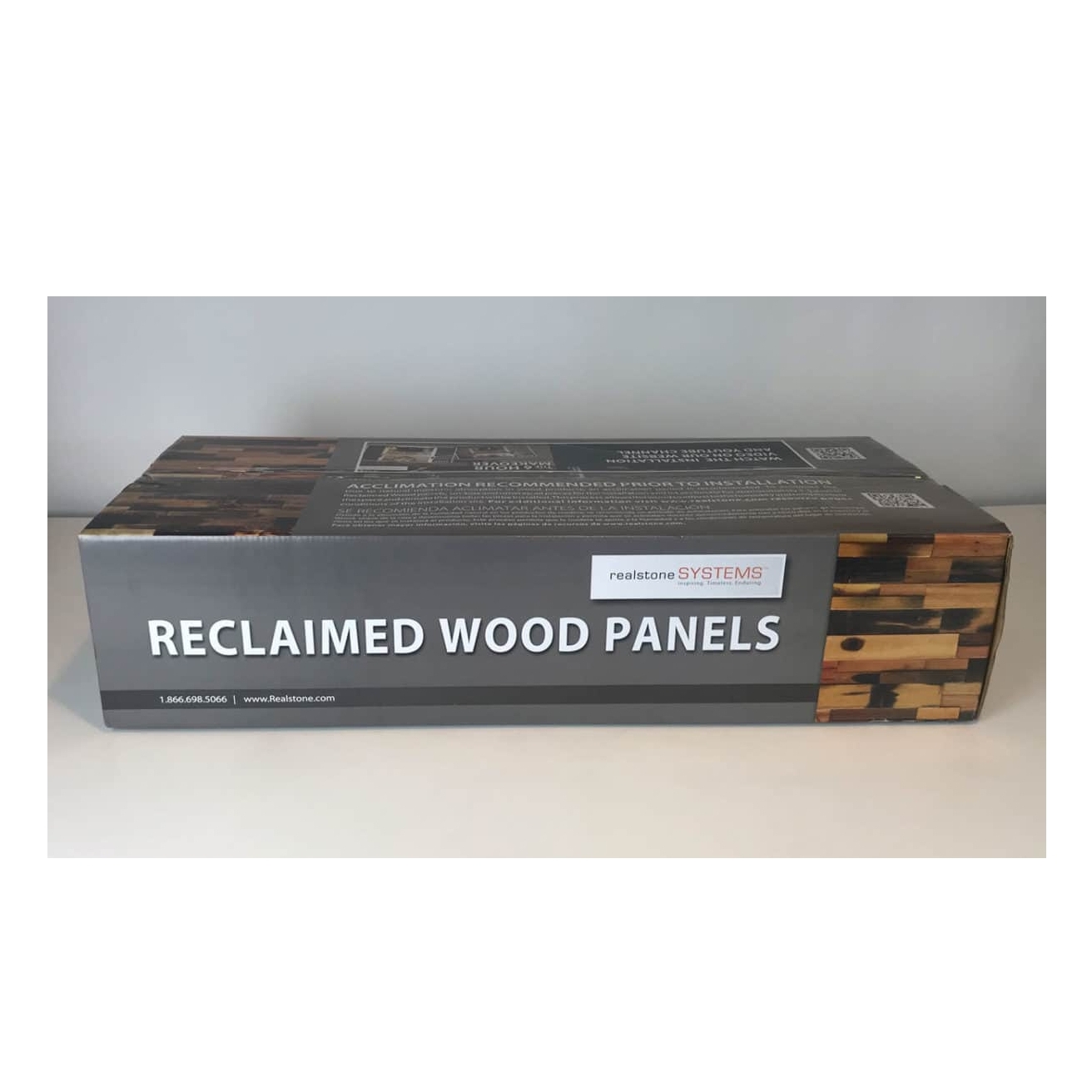 A box labeled 'Reclaimed Wood Panels', showcasing a wooden design with a natural finish, suitable for home improvement or decoration.
