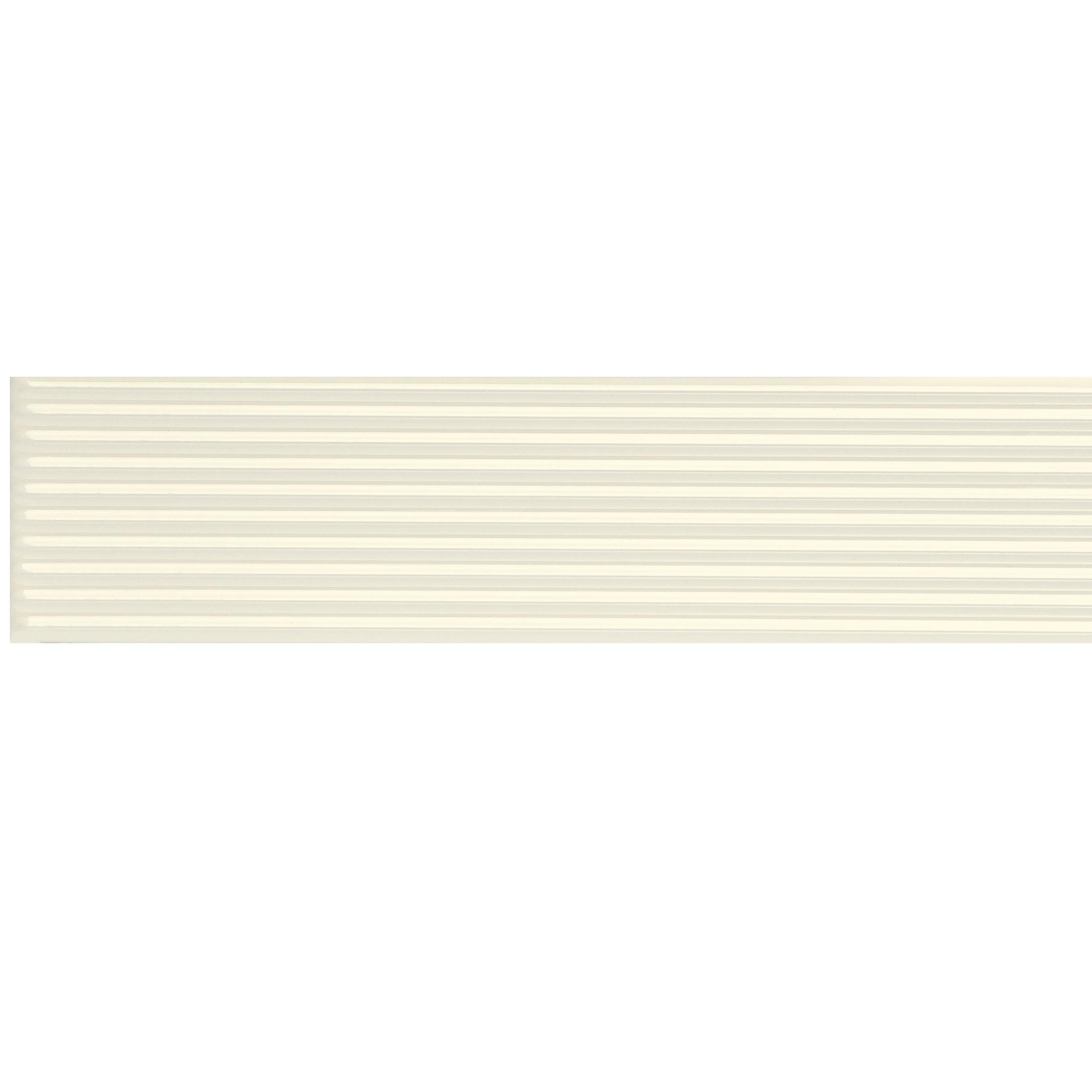 A long, light-colored horizontal surface with parallel lines running across it, creating a subtle striped pattern.