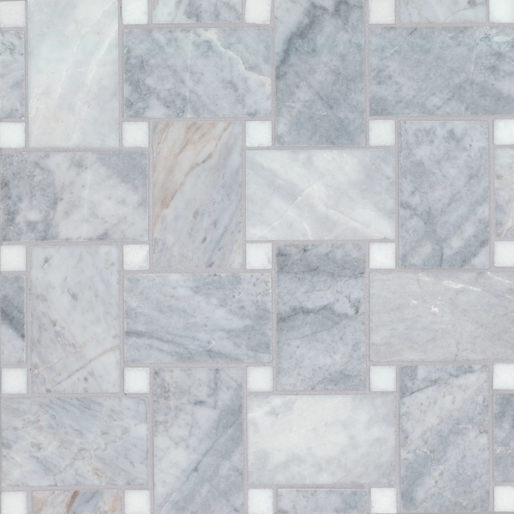 A mosaic pattern of light gray marble tiles arranged in various rectangular shapes, featuring subtle veining and small white spacers between them.