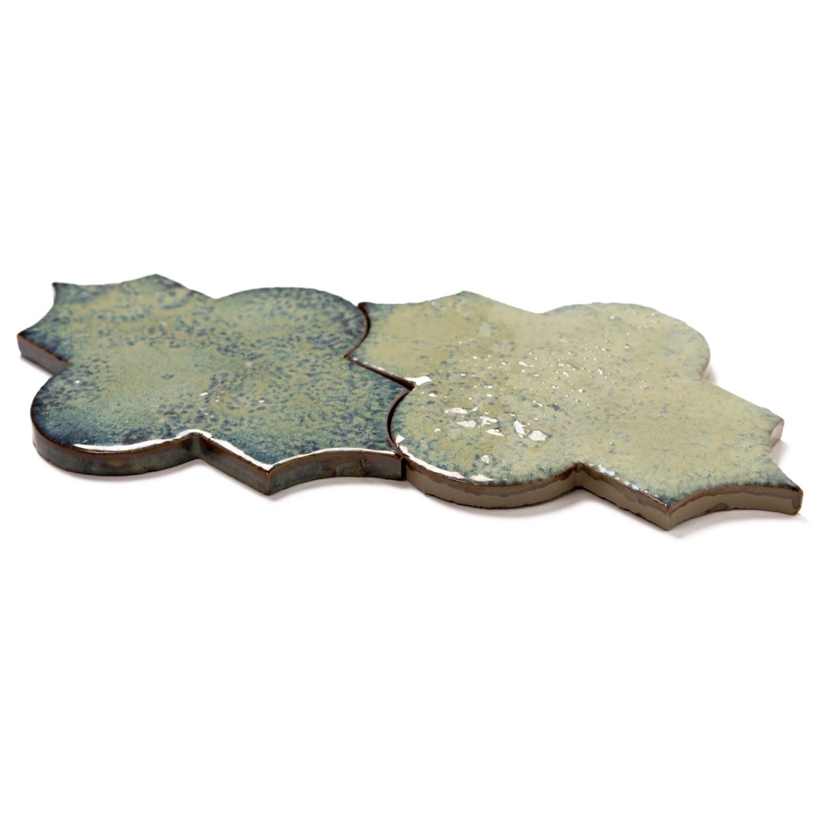 A decorative tile featuring a unique shape with a greenish-blue and light beige color scheme, showcasing a glossy finish.