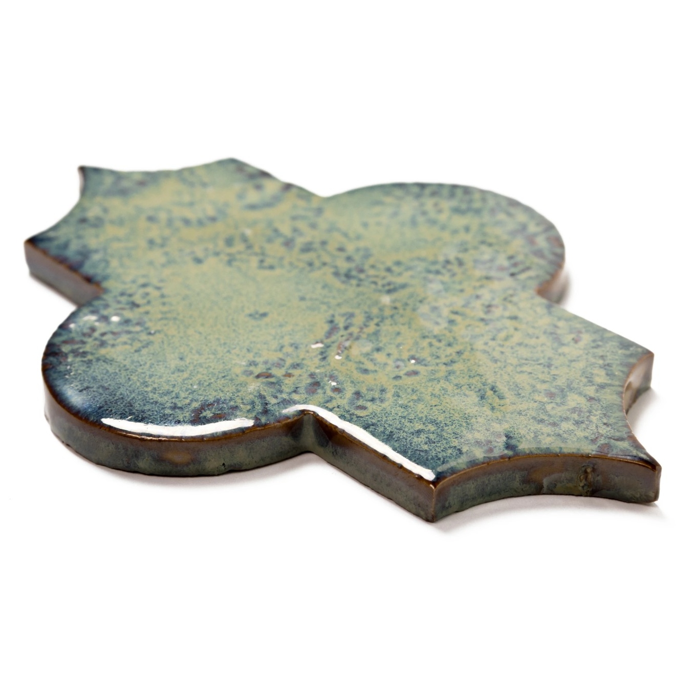 A decorative tile with a unique shape, showcasing a textured surface in shades of blue and green.
