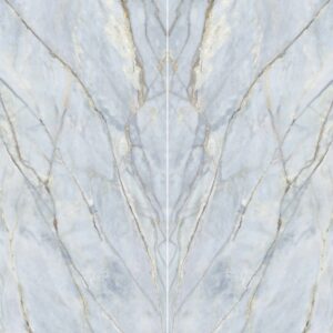A marbled surface with light blue tones and elegant golden veining, creating a symmetrical and polished appearance.