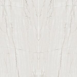 A light-colored marble surface with subtle veins and a smooth, polished texture.