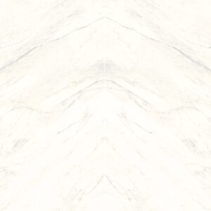 A smooth, white marble surface with subtle grey veins creating a natural marbled pattern.