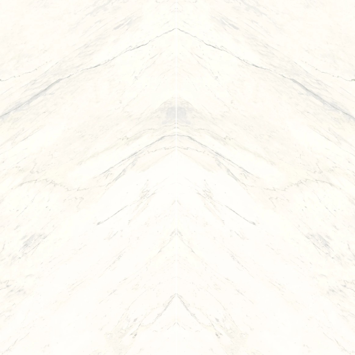 A smooth, white marble surface with subtle grey veins creating a natural marbled pattern.