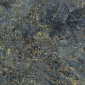 A textured surface featuring a blend of deep blues and golds, resembling a natural stone or marble pattern.