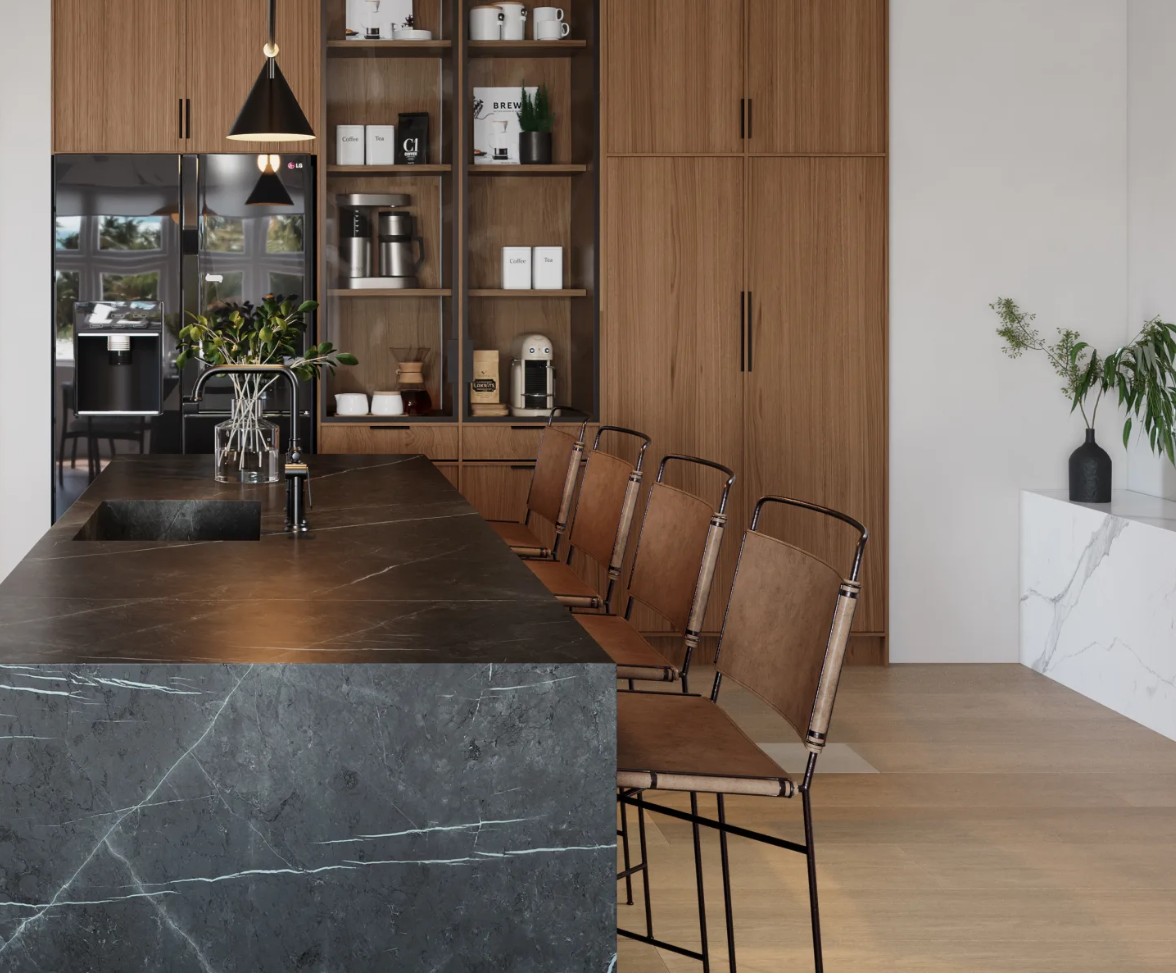 A sleek kitchen interior featuring a dark stone island, wooden cabinetry, and minimalist seating, creating a modern and inviting atmosphere.