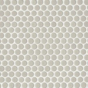 A textured surface composed of evenly spaced, small circular patterns in light gray tones.