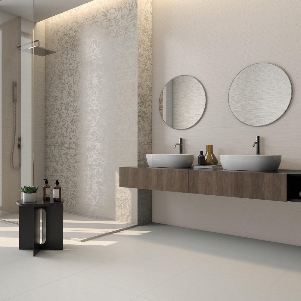 A modern bathroom featuring dual circular mirrors, a wooden vanity with sinks, minimalist decor, and a soft, neutral color palette.