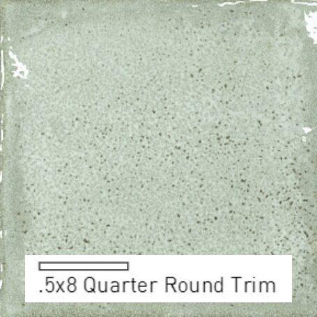 A smooth, light green tile with a speckled texture, labeled as .5x8 Quarter Round Trim.