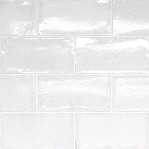 A glossy, white brick tile arrangement with varying shine levels, creating a clean and modern aesthetic.